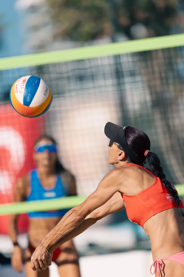 Ball flying toward a player in orange